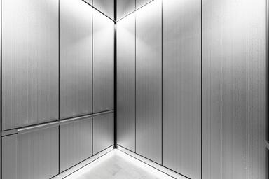 LEVELr-203C Elevator Interior; panels in Stainless Steel with Seastone finish
