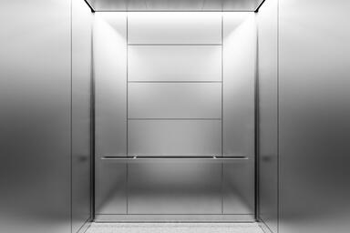 LEVELr-205A Elevator Interior; panels in Stainless Steel with Seastone finish