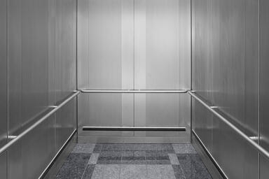 LEVELc-1000A Elevator Interior in Stainless Steel with Sandstone finish 