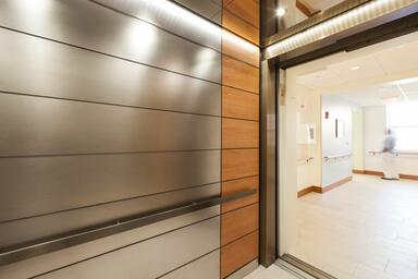 LEVELe-103A Elevator Interior with main panels in Fused White Gold, Sandstone