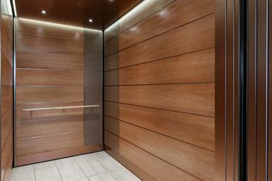 LEVELe-103A Elevator Interior with Minimal panels in custom wood veneer
